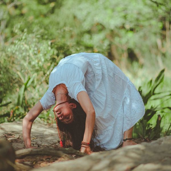 A person meditating peacefully in a bright, serene environment.